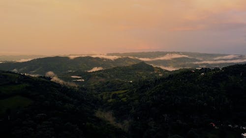 Drone Footage of Green Mountains at Sunrise 