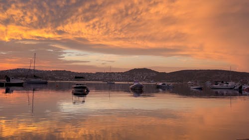 Boats Anchored in a Bay under a Dramatic Sunrise Sky