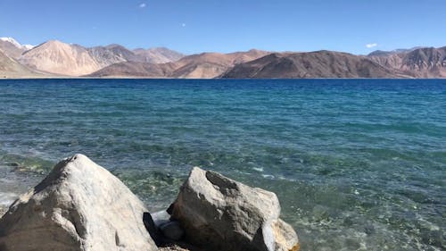 Body Of Water With View of Mountains