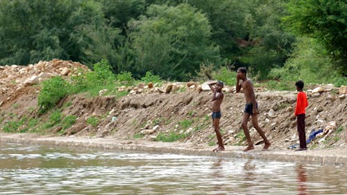 Men Diving in River