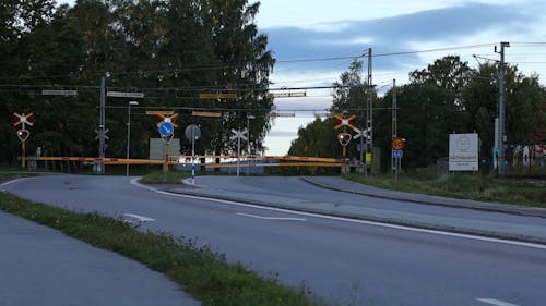 Passenger Train Passing Railway Crossing