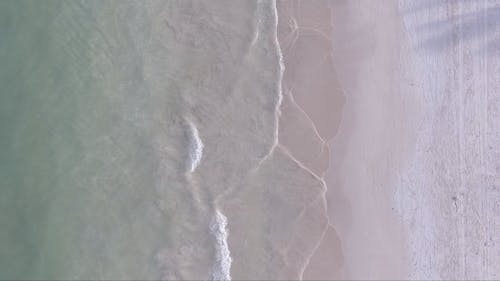 Waves on Beach in Overhead View