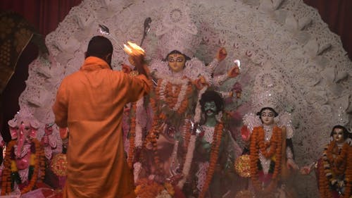 Man Praying in Front of Altar