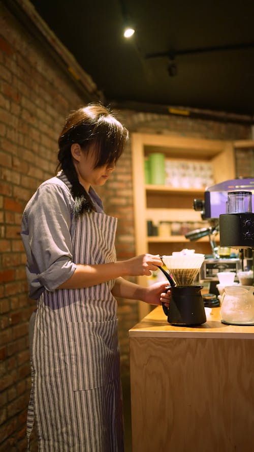 A Woman Making Coffee