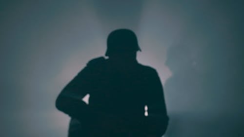 Silhouettes of Soldiers in Fog