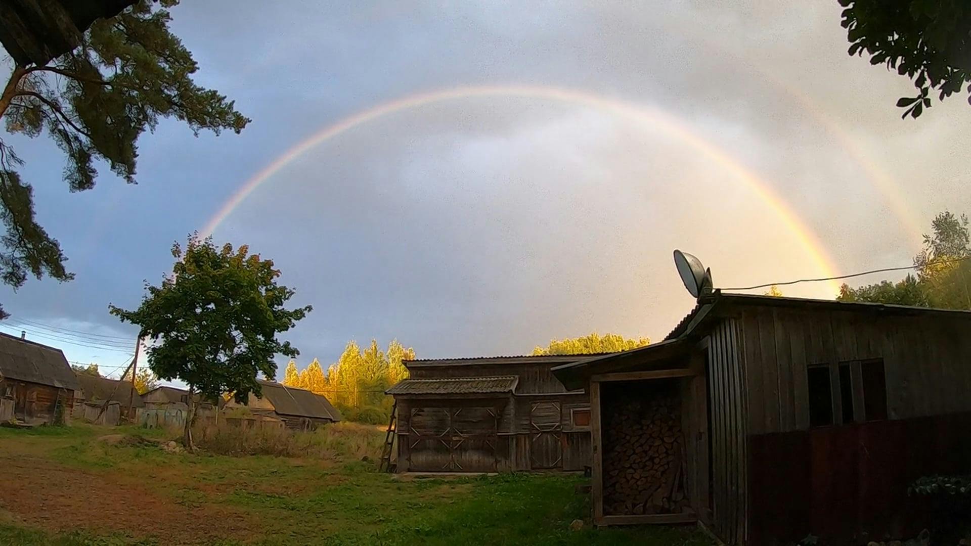 Rain Clouds and a Double Rainbow over a Small Village Free Stock Video ...