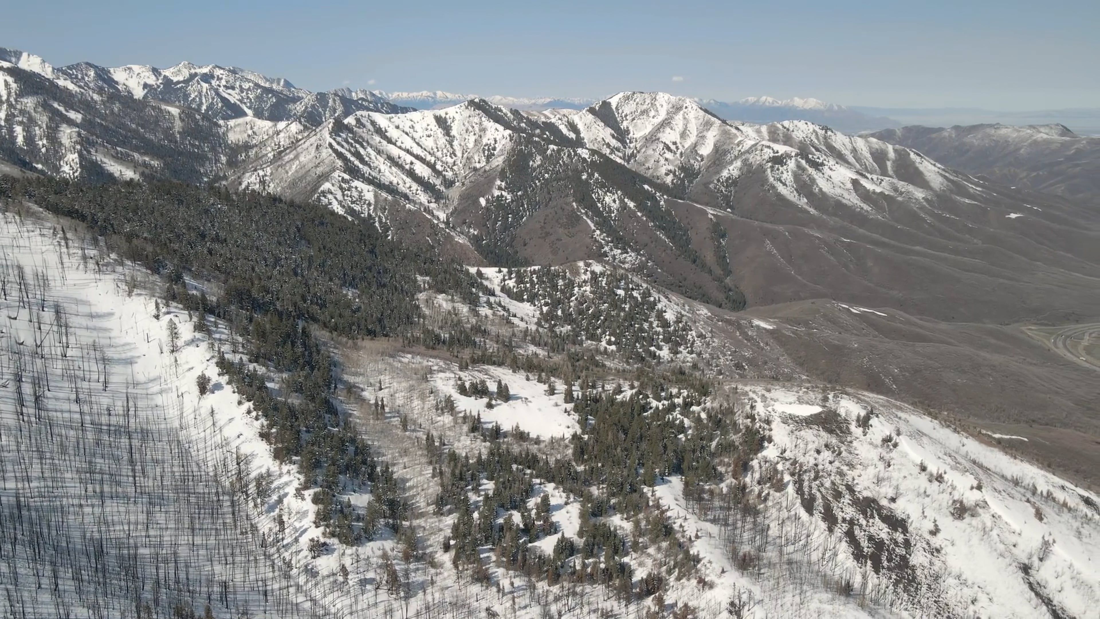 panoramic view of snow capped mountains and a long road 13754948 — free pexels stock footage