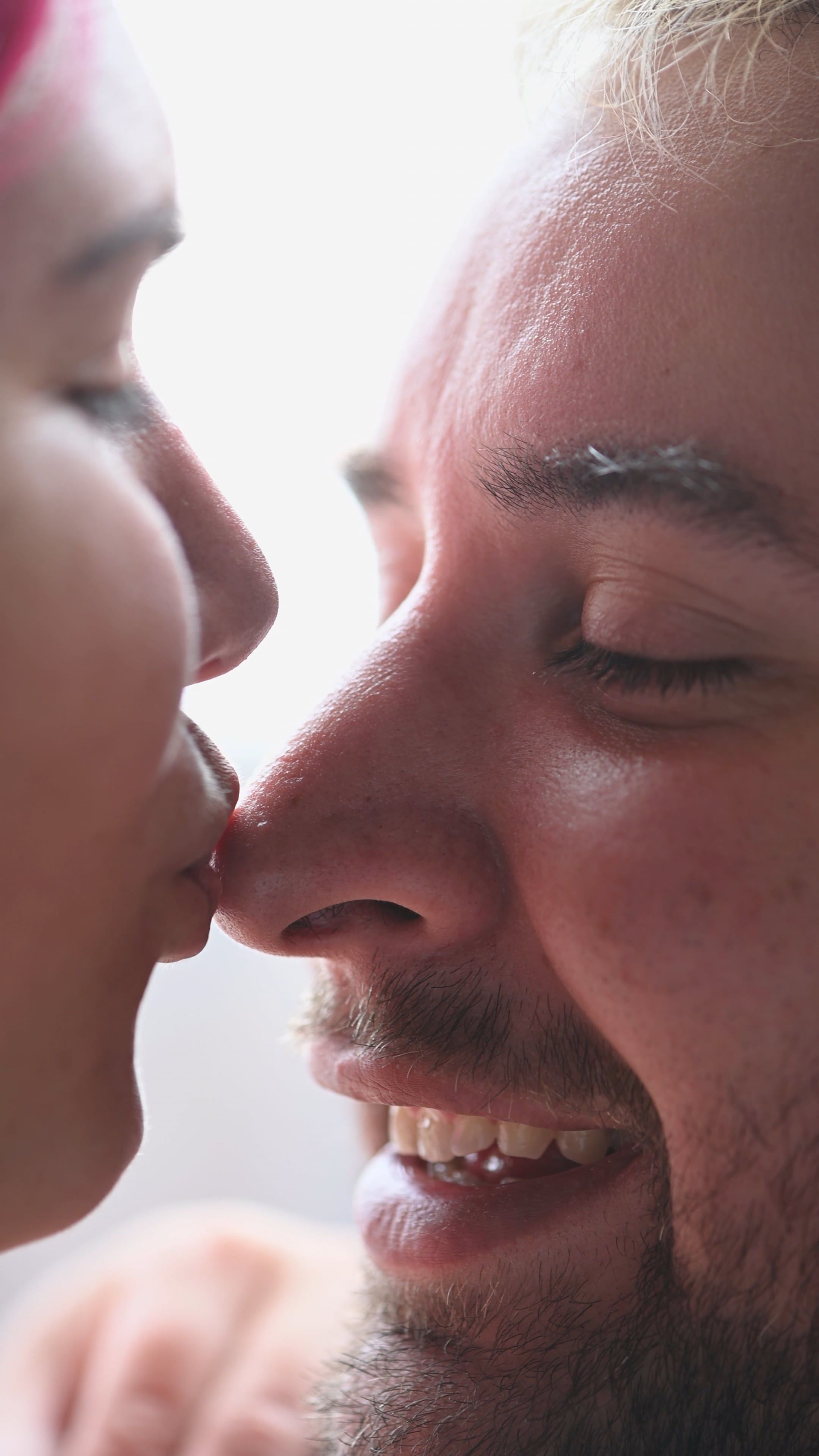 Extreme Close up of a Young Woman Kissing her Partner on the Nose Free ...