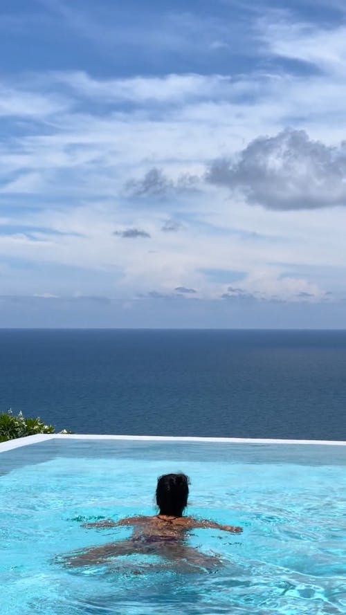 A Woman Swimming in a Pool