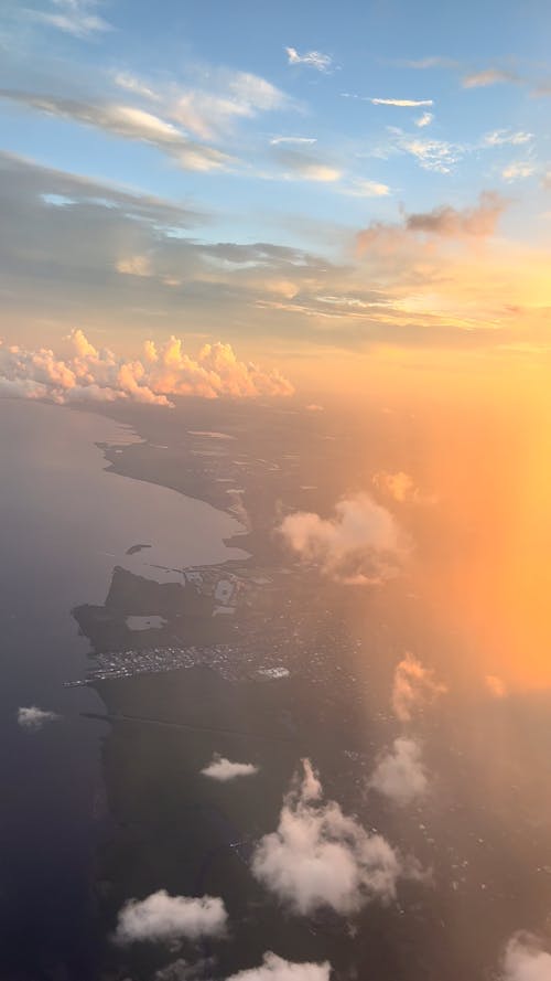 Airplane Window View over a City at Sunset