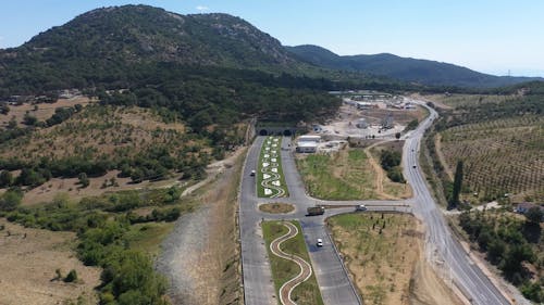 Roads Leading to Tunnels under Hills