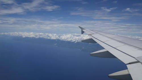 Aerial View of a Coastal Area from an Plane Window 