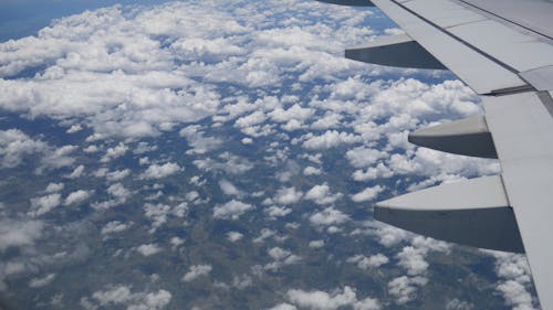 Clouds in Sky and Aircraft Wing