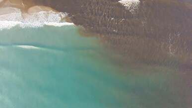 aerial view of a river plume on the coast of la guajira colombia