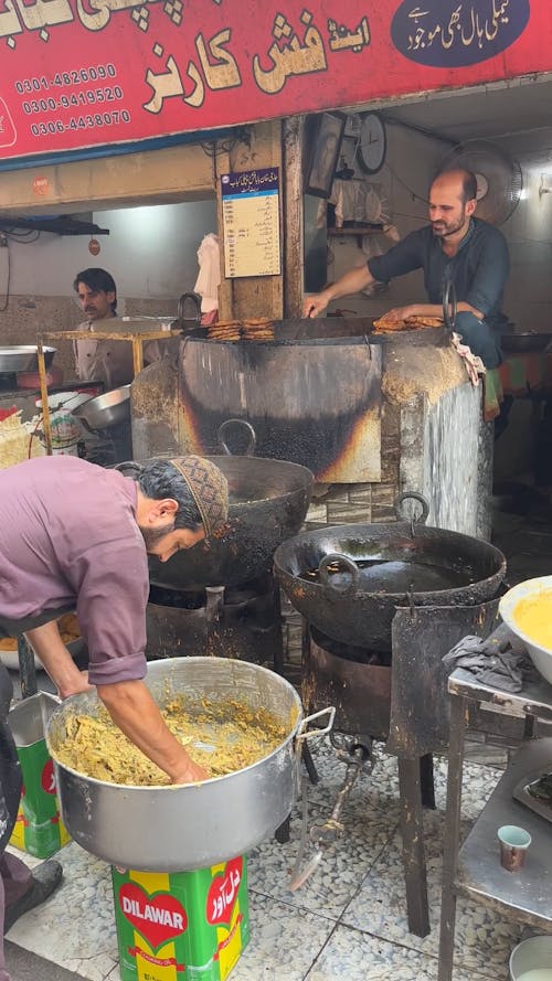 Preparing Food in Street Restaurant