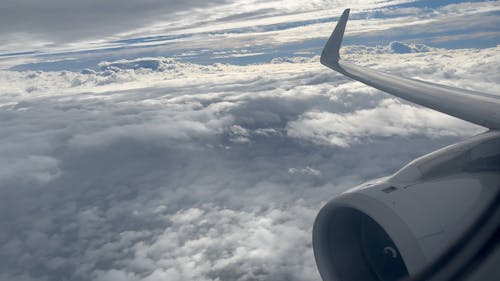 View from an Airplane Window Flying among the Clouds 