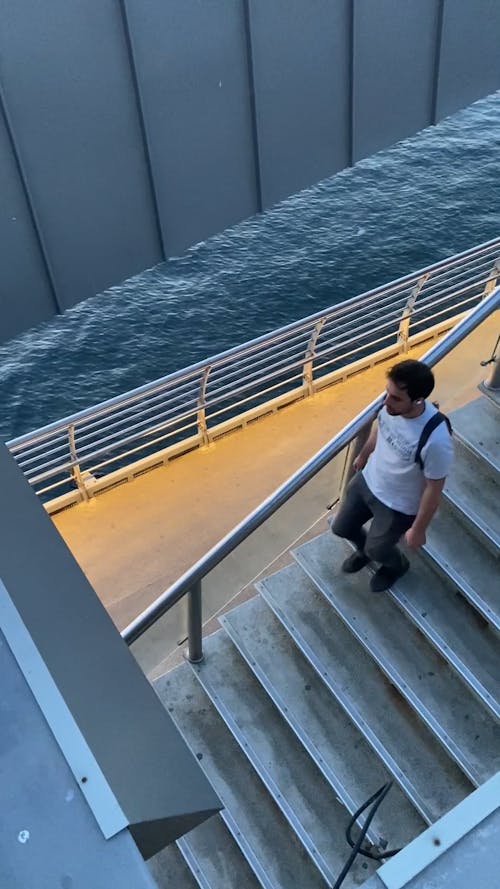 Man Walking on Stairs on Ship