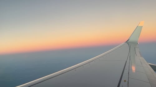 Airplane Window View of a Colorful Sunset Sky 