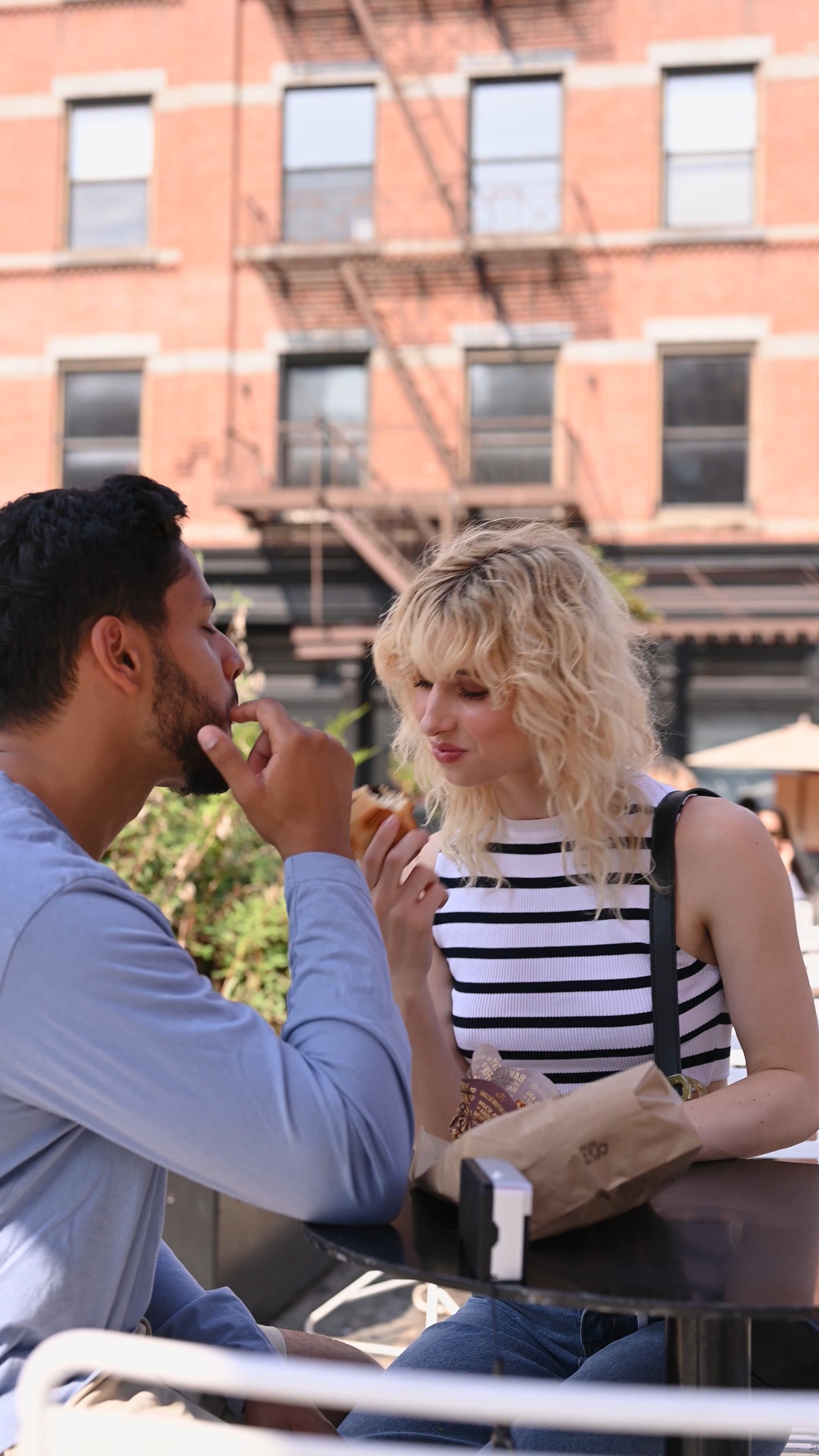 A Happy Couple Eating Muffins at an Outdoor Café Free Stock Video ...