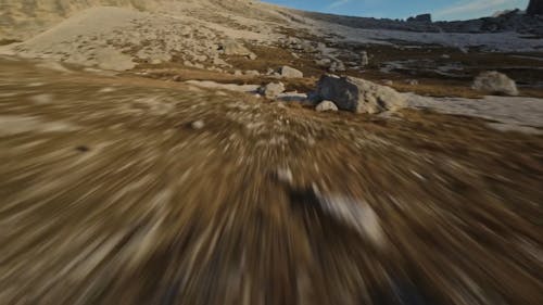 Drone Footage over Barren Area with Stones and Rocks