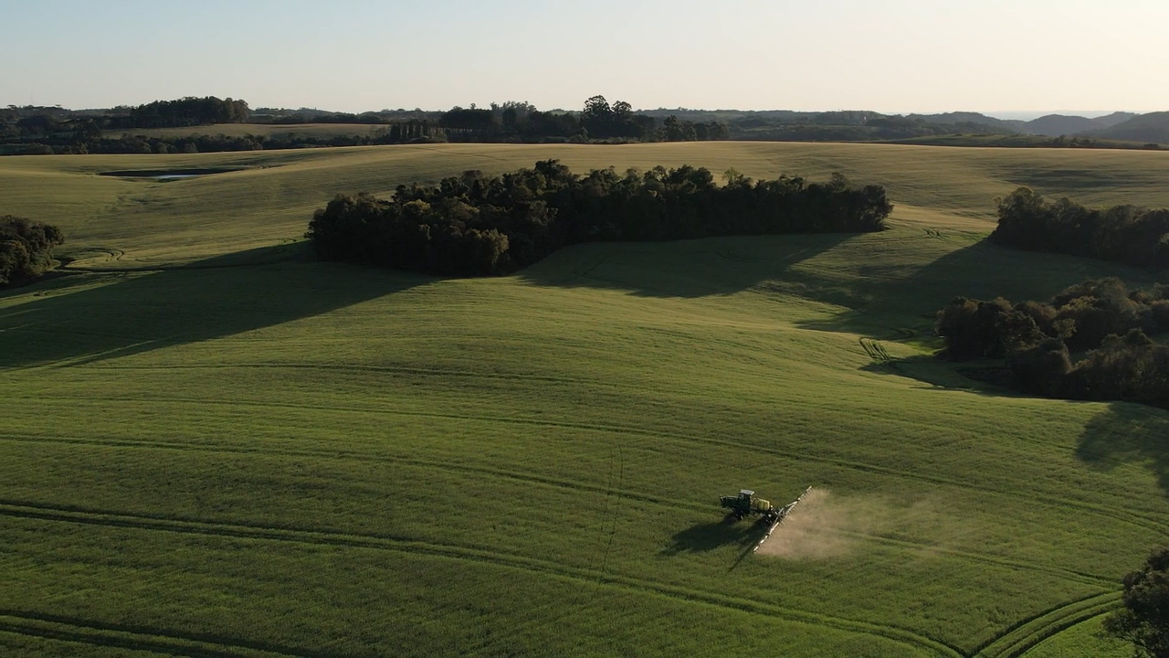 Aerial View of a Tractor Spraying Herbicides on a Field Free Stock ...
