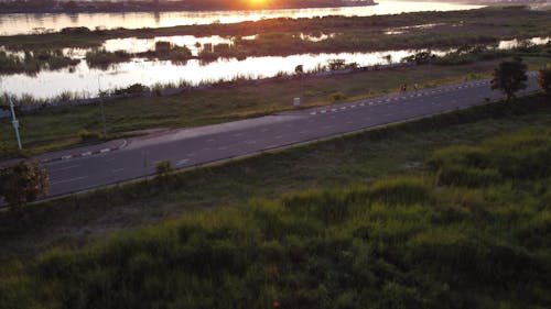 Sunset Over the Road and River in Laos