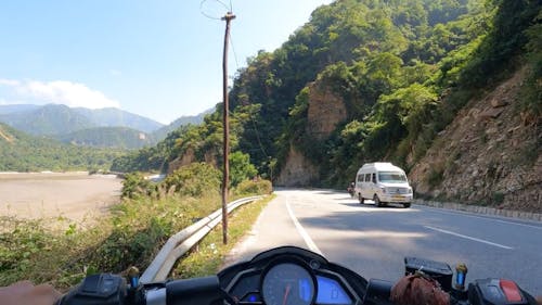Riding Motorcycle on Road in Mountains