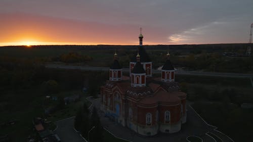 An Orthodox Church by a Road at Sunset