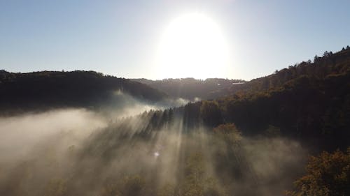 Drone Video of a Misty Mountain Landscape at Sunset