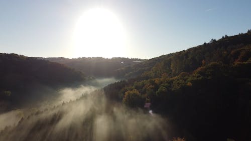 A Misty Mountain Landscape at Sunset