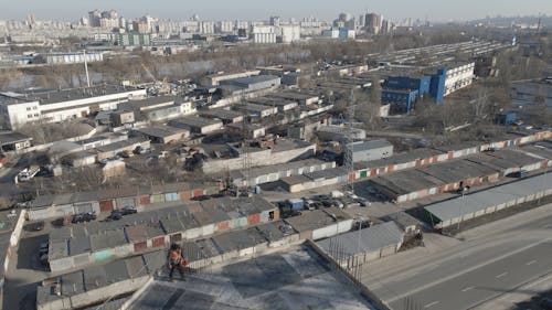 Drone Footage of Construction Workers on Top of a Building 