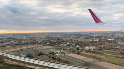 Window View from a Plane Landing at the Airport