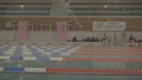 People Training at an Olympic Swimming Pool 