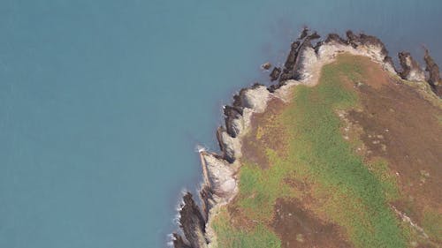 Top View of a Cliffed Coast and a Small Beach 
