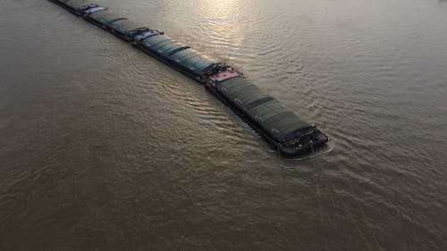 Cargo Boat Going Down the River in Bangkok