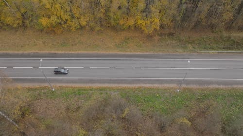 Cars Passing by in a Road 