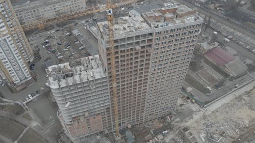 Drone Footage of a Building Construction with Cranes