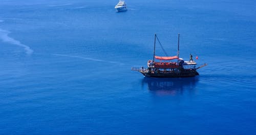 A Wooden Ship Sailing the Blue Sea 