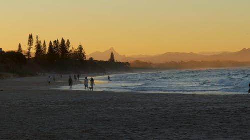 People on Beach at Sunset