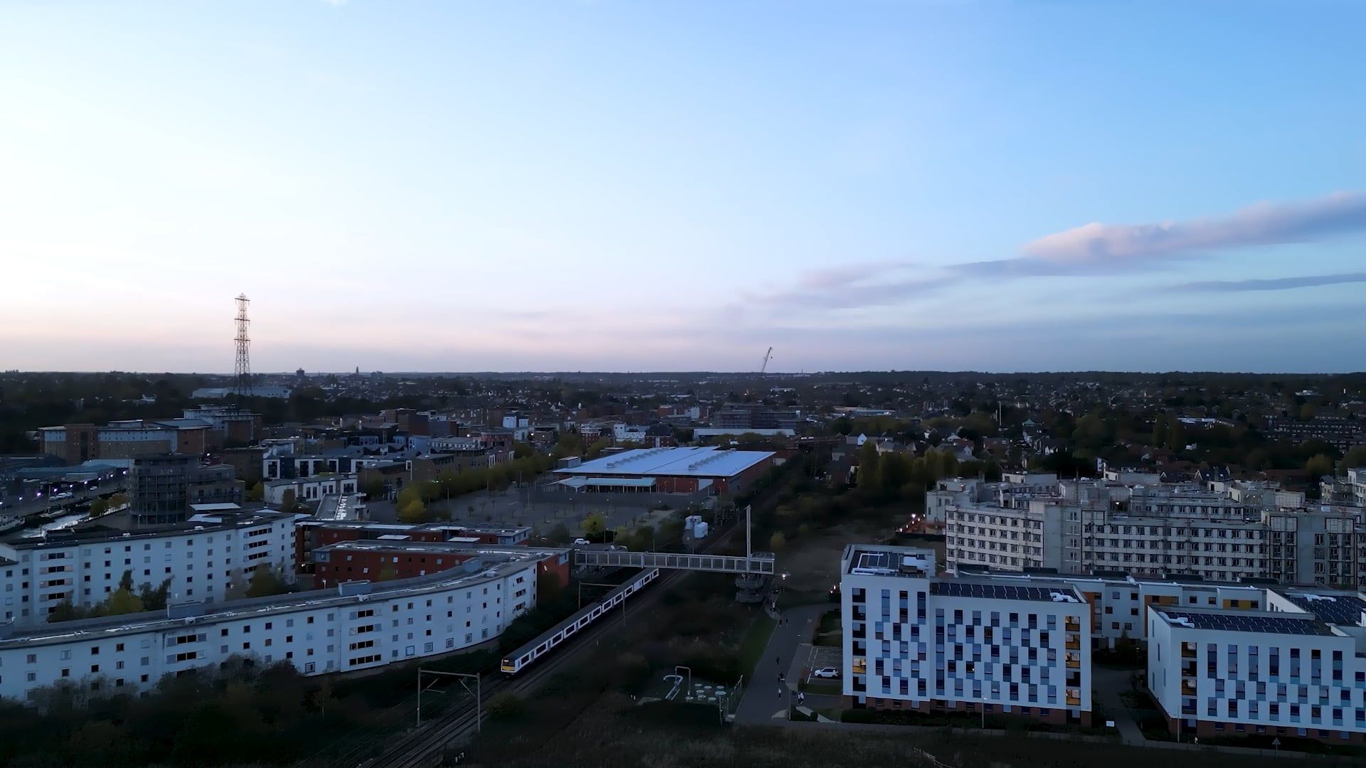 drone view of a train passing by the buildings 14203320 — free pexels stock footage