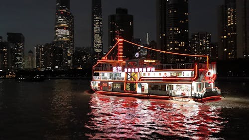 Cruise Ship in City in Evening