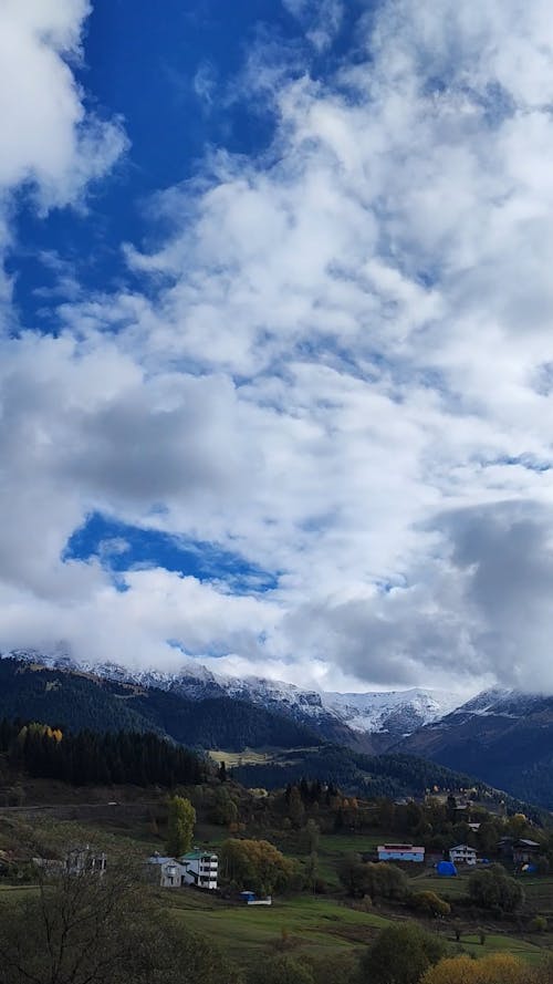 Clouds over Village in Mountains