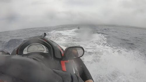 Riding a Jetski in the Ocean on a Cloudy Day 