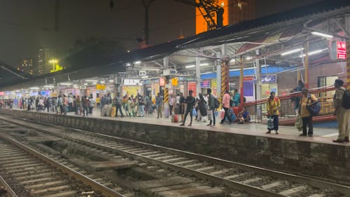 People Waiting on Train Station at Night