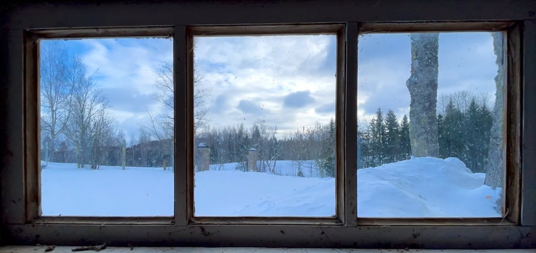 A view of the snow covered ground through a window Free Stock Video ...