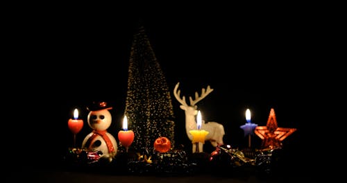 Burning Candles and Christmas Decorations 