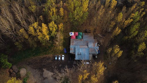 Drone Footage of a House in the Forest in Autumn 