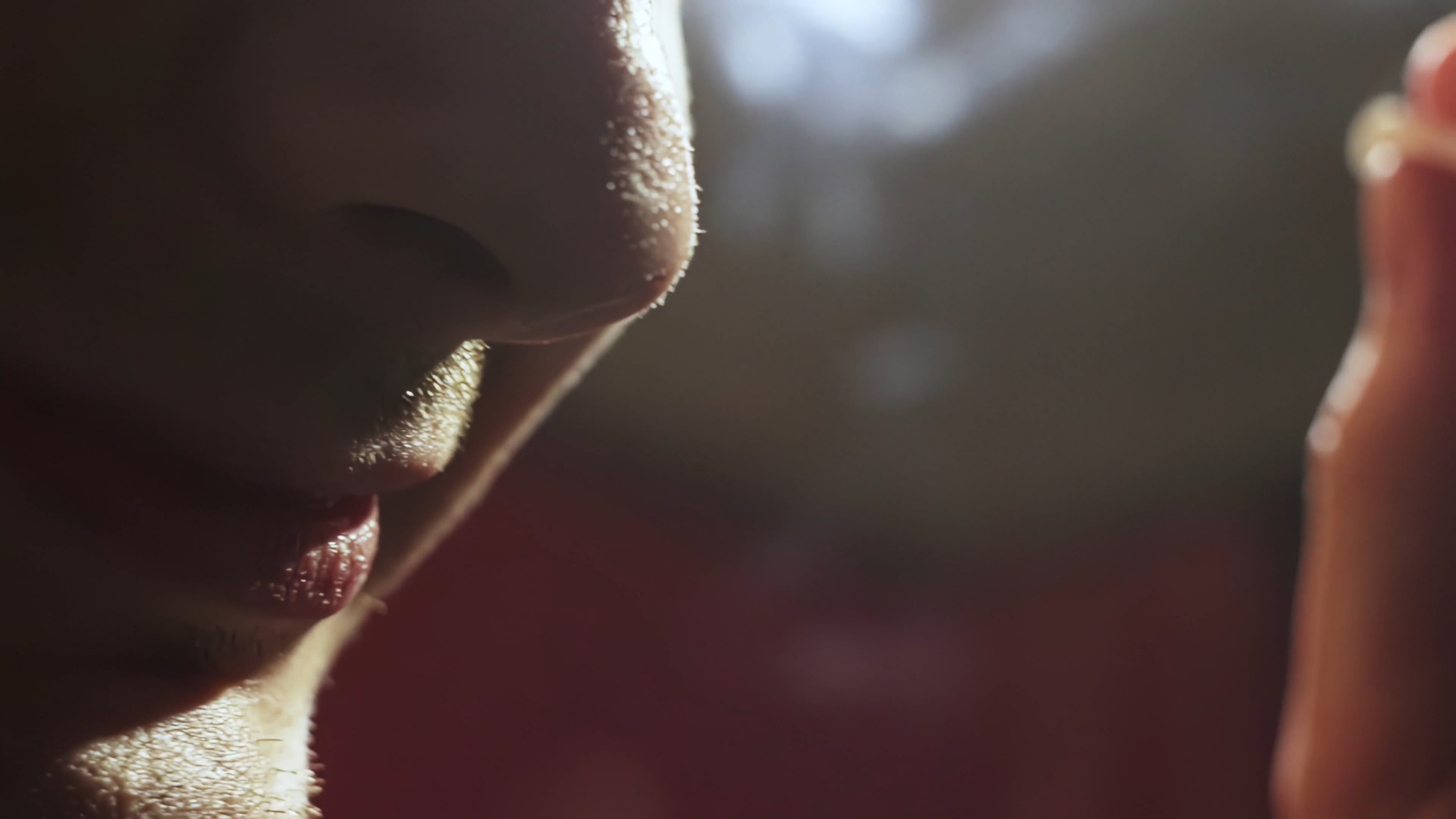extreme close up of a man smoking a cigarette 14500434 — free pexels stock footage