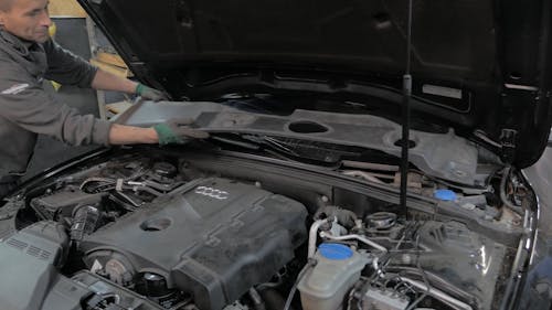 Man Repairing a Car