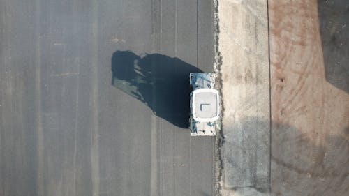 Top View of an Asphalt Compactor Working on a Road 